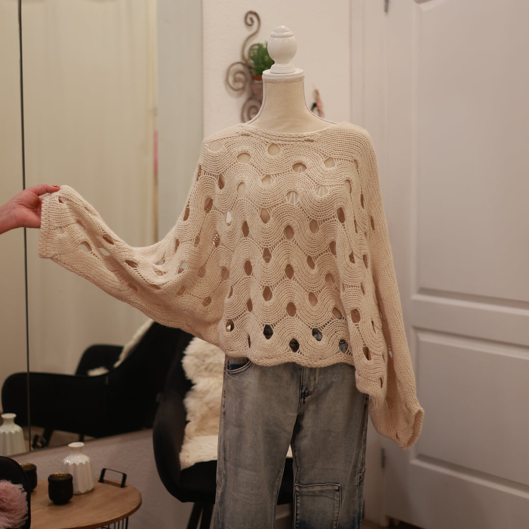 Strickpulli mit Lochmuster